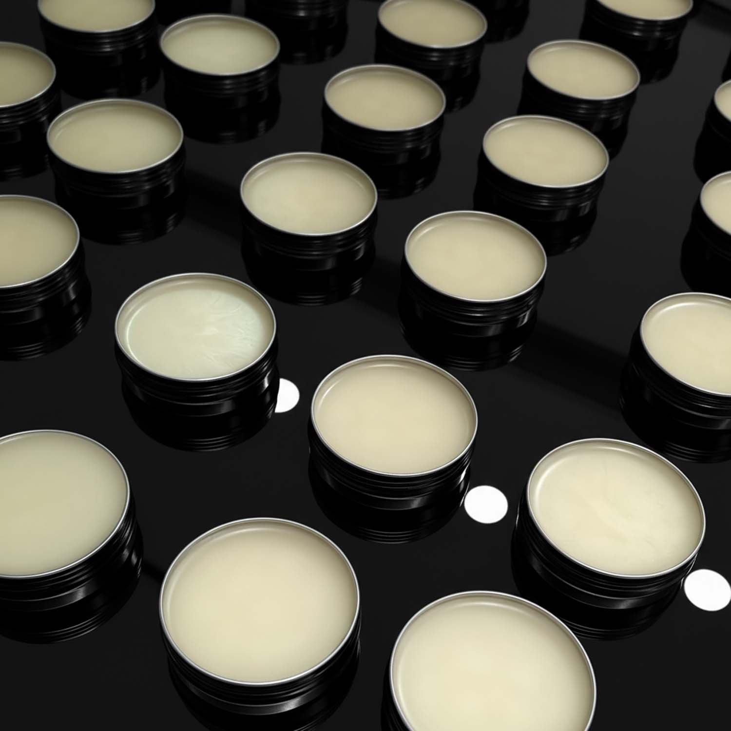 Multiple small containers with beard balm