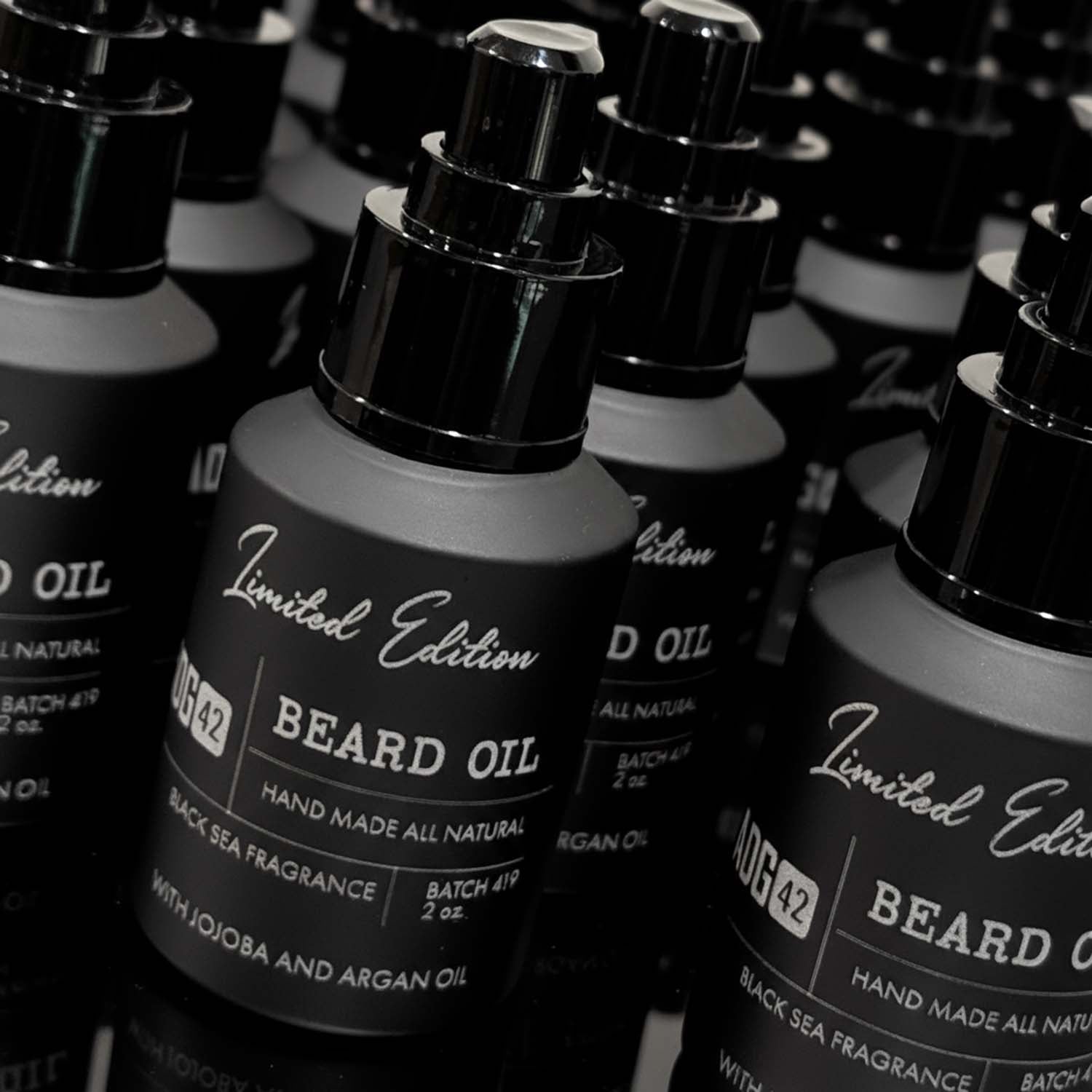 Bottles of Limited Edition beard oil with black and white labels.