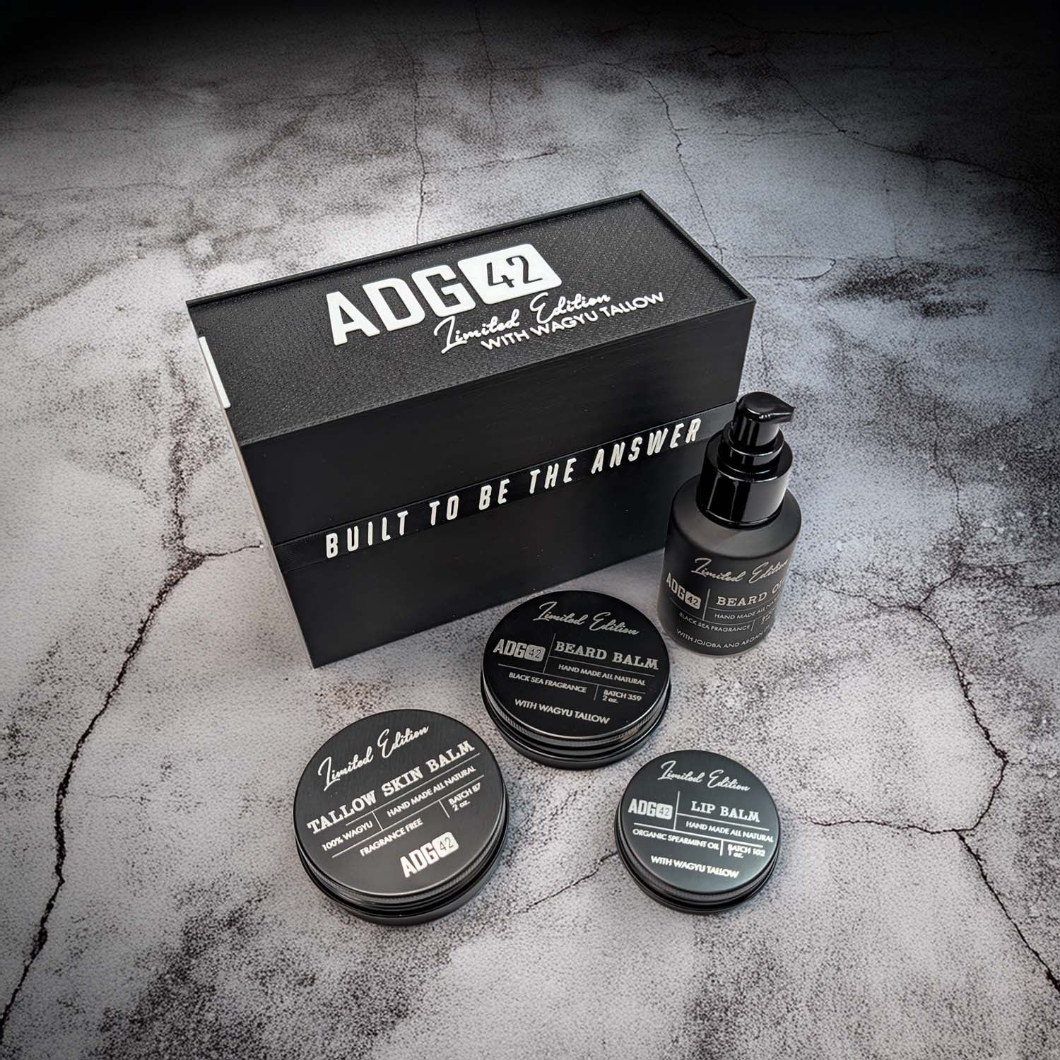 ADG42 skincare product set on a textured surface