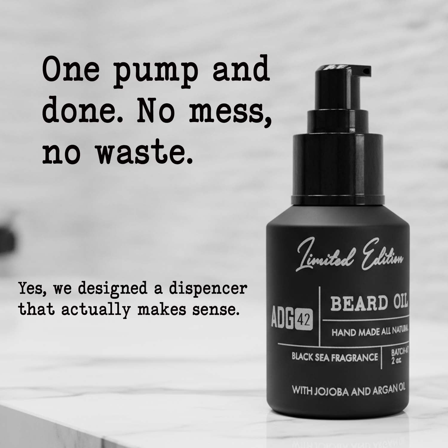 Black beard oil bottle with pump dispenser on a light background