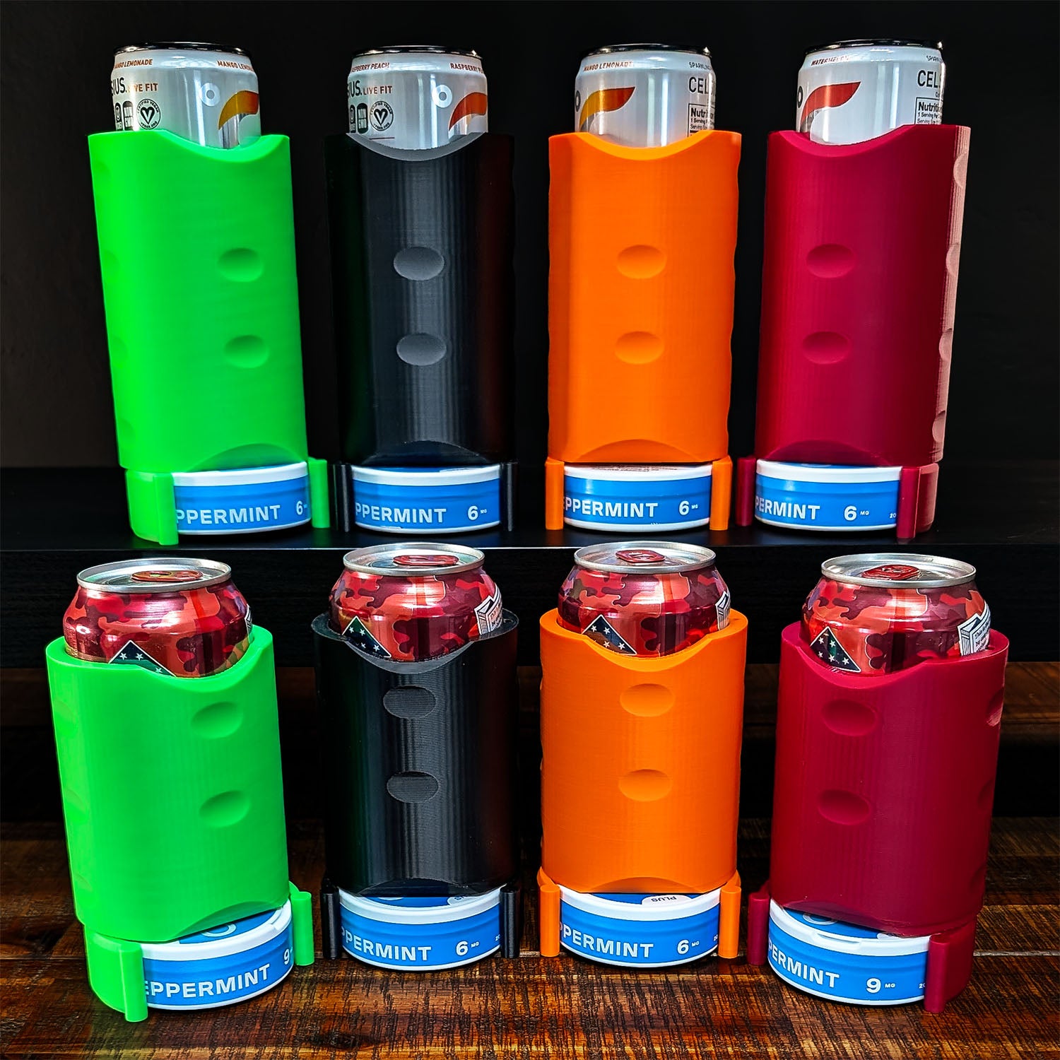 Set of colorful can coolers with drinks on a wooden surface. "The Stacker" by ADG42