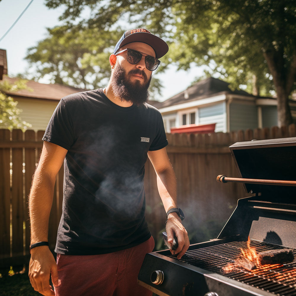 Dad in backyard wearing a dad hat and dad shirt